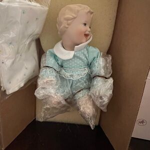 Porcelain Baby Doll in Blue Outfit
